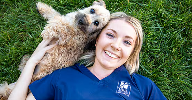 Vet nurse with a grey and brown cats